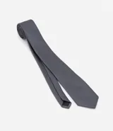 Corbata masculina de diseño clásico con textura y estampado de lunares pequeños.