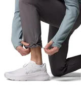 Pantalón de senderismo Columbia modelo Essential Hike para hombre, de color gris, con diseño ligero, elástico y tecnología de repelencia Omni-Shield. Cuenta con bolsillos con cremallera y dobladillo ajustable.