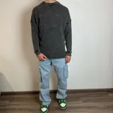 Buzo de corte oversize confeccionado en tela waffle de algodón, con cuello redondo y diseño de hombros caídos.