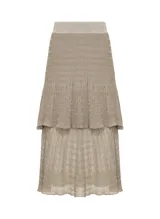 Pollera midi plisada color beige con lurex dorado, cintura elastizada y corte evasé.