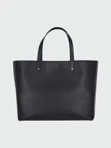 Bolso tote de cuero color beige claro, con asas superiores y silueta rectangular.
