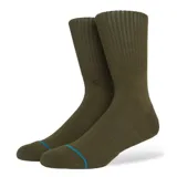 Medias Stance Icon color verde con logo bordado en el tobillo y banda azul en el arco del pie.