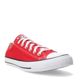 Championes Converse modelo Chuck Taylor All Star de corte bajo, confeccionados en lona roja con puntera de goma blanca, cordones blancos y suela de goma vulcanizada con franja negra.