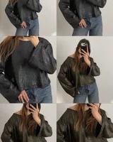 Sweater de punto con acabado metalizado, diseño holgado, cuello redondo y mangas largas acampanadas.