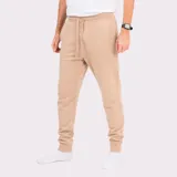 Pantalón tipo babucha de corte ajustado, color gris oscuro, con cintura elástica y cordón de ajuste. Presenta puños elásticos en los tobillos y bolsillos laterales.