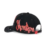 Gorra Capslab unisex negra con estampado de salpicaduras blancas y visera con glitter. Presenta un parche frontal con el dragón Shenlong de Dragon Ball Z y detalles en rojo en la visera y el lateral.
