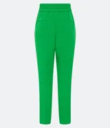 Pantalón zanahoria de vestir color verde, con cintura alta, bolsillos laterales con detalle de botones y corte sastrero.