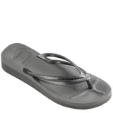 Sandalias tipo ojota Havaianas color negro, con diseño de plataforma y tiras finas con textura grabada.