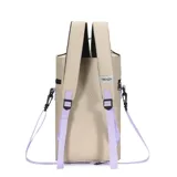 Mochila matera color beige con detalles en lila y negro. Cuenta con un bolsillo frontal extra, correa y llavero desmontable, y tiras con tela mesh. Tiene un parche de corazón lila en la parte superior y la palabra "TRENDY" estampada en lila en el bolsillo frontal.