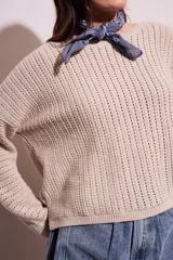 Sweater celeste de tejido de punto calado con lurex, de corte holgado y mangas largas.