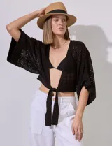 Bolero calado negro de poliéster con mangas 3/4 y frente abierto con lazo.