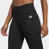 Calza de entrenamiento Adidas Essentials, color negro, tiro alto y largo de siete octavos. Confeccionada en tejido entrelazado con tecnología de absorción AEROREADY.