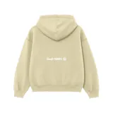 Hoodie oversize de felpa color gris claro, con capucha y bolsillo frontal tipo canguro. Presenta un bordado central en color negro con el texto 'venelo'.