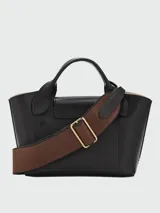Cartera tipo tote XS Longchamp de la línea Épure Timeless, color negro, con asas superiores y correa ajustable y desmontable en tono marrón oscuro.