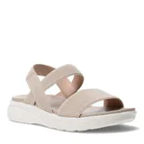 Sandalias de plataforma con tiras elásticas texturizadas en color beige. Presentan una base ergonómica de goma blanca con diseño estriado y plantilla acolchada al tono.