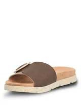 Sandalias tipo slide con tira ancha en tejido texturizado color beige y detalle de hebilla circular decorativa en tono marrón. Presentan una base ergonómica con suela de poliuretano ligera y flexible.