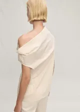 Blusa sin mangas de diseño recto con cuello asimétrico y drapeado, confeccionada en una mezcla de algodón y poliamida.