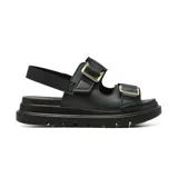 Sandalia de plataforma Korium Confort modelo Kacey, color negro, con dos tiras ajustables con hebillas doradas y tira trasera de sujeción. Suela gruesa dentada.