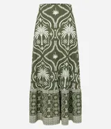 Pollera larga (midi/maxi) de tejido piqué, color verde oscuro con estampado en blanco/beige de motivos tropicales y palmeras. Presenta un diseño con fruncido en la parte inferior.