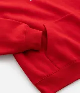 Buzo con capucha de corte boxy, color rojo, con cordón ajustable y bolsillo frontal tipo canguro. Presenta estampa frontal con caracteres orientales y detalle gráfico en color negro.