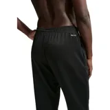 Pantalon de entrenamiento Nike Hyverse color negro, con cintura elástica, puños acanalados en los tobillos y logo de la marca bordado en blanco en la pierna izquierda.