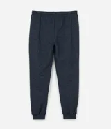 Pantalón de pijama tipo jogger color azul marino, con cintura elástica y cordón de ajuste. Presenta puños elásticos en los tobillos y un acabado jaspeado.