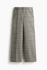 Pantalón sastrero de tiro alto con piernas amplias y pliegues frontales. Presenta un estampado de cuadros Príncipe de Gales en tonos grises, beige y negro.