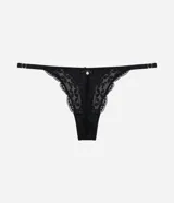 Bombacha colaless Lov modelo string confeccionada en encaje floral negro, con laterales finos ajustables, detalle de lazo pequeño y dije metálico en el centro.
