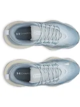Championes deportivos Under Armour modelo W Pulse, color celeste con suela y entresuela gruesa en tonos blancos y celestes.