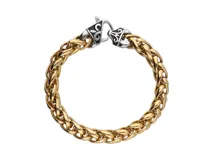 Pulsera dorada de acero torneado con cierre tipo mosquetón plateado con diseño de flor de liz.