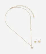 Conjunto de collar corto dorado con dije de ojo turco y strass, y caravanas doradas tipo botón.
