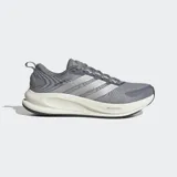 Championes de running Adidas Supernova Ease 2, color gris con detalles en plateado y suela blanca. Presentan exterior de tela técnica, mediasuela Dreamstrike para mayor amortiguación y suela de caucho soplado para una tracción dinámica.