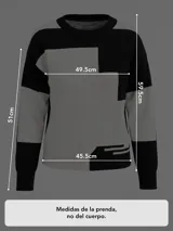Buzo de tejido de punto con diseño geométrico en bloques de color blanco y negro, cuello redondo y mangas largas.