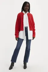 Jeans de tiro medio color azul oscuro, corte ajustado en la cadera y muslo, con pierna bootcut.