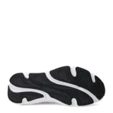 Championes de running Under Armour modelo Rogue 6, color negro con entresuela blanca. Presentan un diseño de malla transpirable en la parte superior, cierre con cordones y logo de la marca en el lateral.