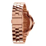 Reloj Nixon modelo clásico con caja y correa de acero en tono oro rosa, esfera minimalista a tono con índices marcados y segundero en contraste.