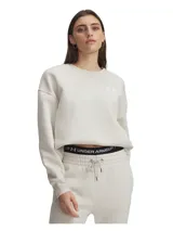 Buzo Under Armour de corte oversize, color beige, con cuello redondo, hombros caídos y logo de la marca bordado en el pecho. Presenta puños y bajo acanalados.