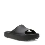 Chanclas Puma modelo Shibui Cat, color negro, con diseño minimalista de una sola pieza y plataforma. Presenta el logo de la marca grabado en el lateral.