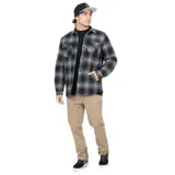 Camisa overshirt de franela a cuadros grises y negros, con forro interior de tafeta. Tiene calce regular, cierre frontal con botones metálicos, cuello camisero, dos bolsillos con tapa en el pecho y dos bolsillos laterales.