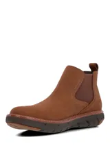 Bota tipo Chelsea de cuero color marrón, con paneles elásticos laterales y suela tecnológica Spinal Flex de EVA y goma para mayor amortiguación y soporte.