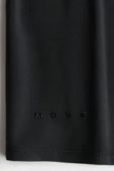 Remera deportiva corta en tejido funcional suave DryMove color negro, de manga corta, con cuello redondo y bajo recto.