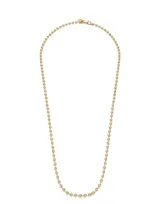 Cadena larga dorada con eslabones de bolitas.