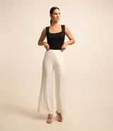 Blusa Cortelle sin mangas de tejido de punto acanalado negro con efecto metalizado, tirantes anchos y escote cuadrado.