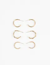 Set de tres pares de aros tipo argolla en tono dorado, con diferentes diseños: un par liso, un par trenzado y un par con textura de cuerda.