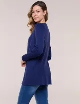 Cardigan abierto tejido en punto acanalado, marca Rio & Rian, de color beige con mangas largas.