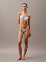 Colaless celeste con encaje elástico transparente y tiras delgadas.