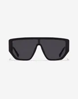 Lentes de sol unisex Hawkers modelo Metro, con montura cuadrada negra y lentes oscuros.