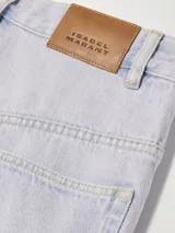 Pantalón de jean de pierna ancha y tiro medio, color lila claro, confeccionado en algodón orgánico.