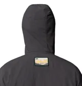 Campera cortaviento Columbia modelo Acker Rock Windbreak, de color gris oscuro, con capucha ajustable con interior estampado, cierre frontal parcial con botones y bolsillo tipo canguro con solapa. Incluye tecnología Omni-Shield y Omni-Shade.