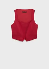 Chaleco de corte sastre con cuello escotado y tirantes anchos. Presenta cierre frontal con botones ocultos bajo tapeta y dos bolsillos de ribete delanteros. Confeccionado en una mezcla de viscosa, lino y algodón con forro interior de algodón.